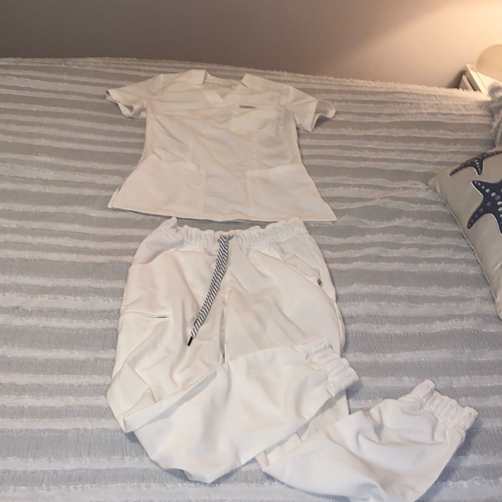 White Jaanuu jogger pant size XS and three pocket scrub top size XS. Nursing!